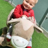 Baby Giuseppe all smiles in his new Noa the Horse Rocker by Nattou